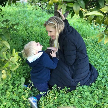 Kristen Tomassi took a picture with her grandchild in her garden.